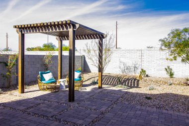 Simple Arbor Over Rear Yard  Wicker Furniture