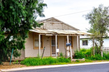 Abandoned Home With Overgrown Weeds clipart