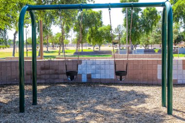 Baby's Swing At Free Local Park clipart