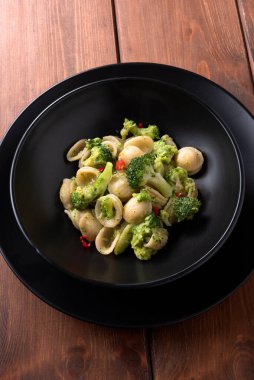 Dish of delicious orecchiette with broccoli and chili, italian pasta