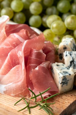 Prosciutto served with Dor Blu and grapes