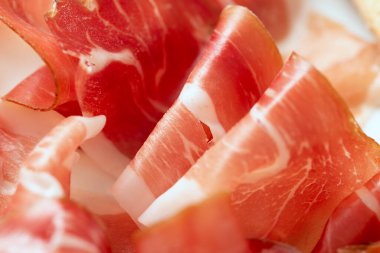 Closeup view of thin prosciutto slices 