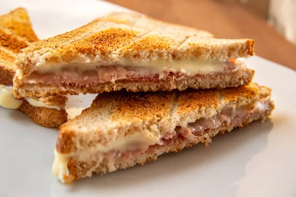Delicious toast sandwich filled with prosciutto and cheese