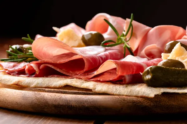 stock image Platter with delicious typical cold cuts and pecorino, Italian appetizers, European food 