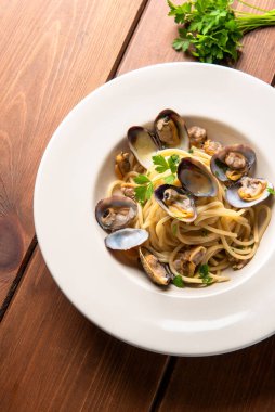 Plate of delicious spaghetti with mussels, clams and bottarga, Italian food clipart