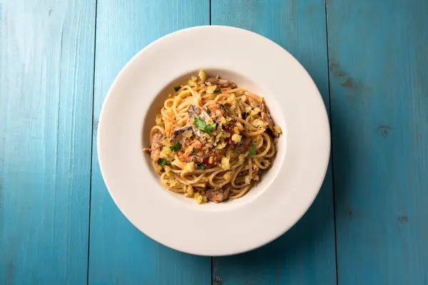 stock image Plate of typical spaghetti with mullet bottarga, sardinian pasta, italian cuisine