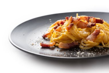 delicious spaghetti alla carbonara on the plate on table, close up clipart