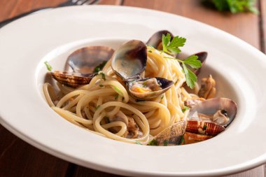 Spaghetti with mussels, clams and bottarga, italian pasta, mediterranean recipe clipart