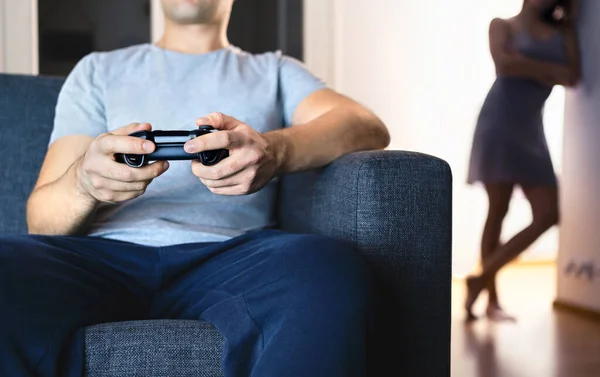Couple having problem with video games. Girlfriend jealous of technology. Distant marriage, divorce. Unhappy lonely wife, lazy husband ignoring family. Distracted gamer man. Fight in relationship.