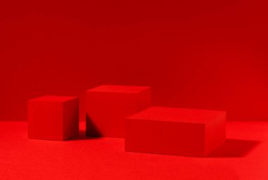Red scene, red stage for product presentation made with cube shapes. Studio photography.