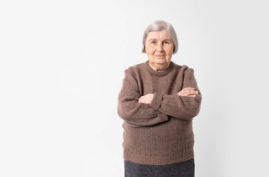 Old woman. 80 years old grey haired elderly woman on white background with copy space.