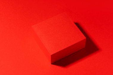 Red scene for product presentation, red stage made with cube shape. Studio photography.