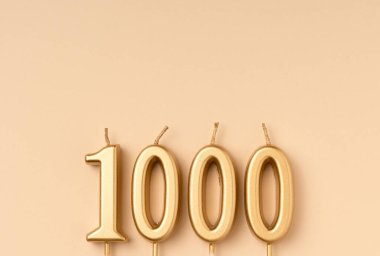 Number 1000 celebration festive background made with golden candles in the form of number Thousand. Universal holiday banner with copy space. clipart