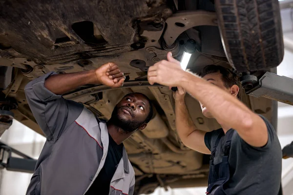 Two Diverse Handsome Mechanics Uniform Examining Car While Working Auto — Zdjęcie stockowe