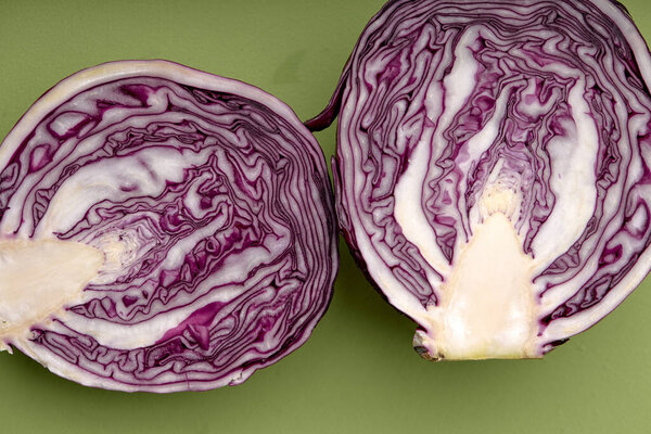 Slices half of cabbage Isolated on green Background Top View. Advertising, Cuisine Menu, Food. close-up. view from above, close-up