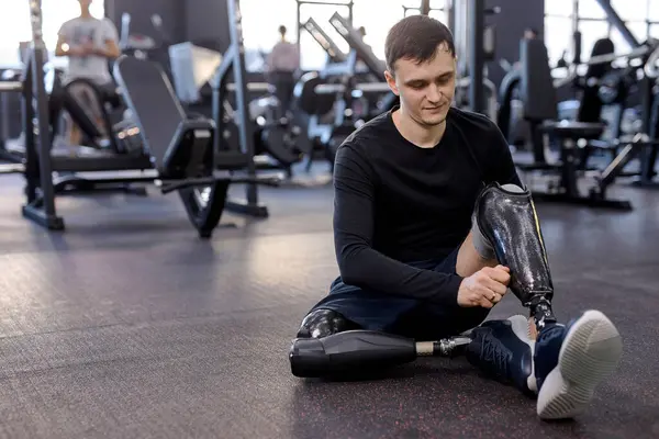 Pleasant Young Sportsman Putting Artificial Leg Training Preparation Workout Close — Stock Photo, Image