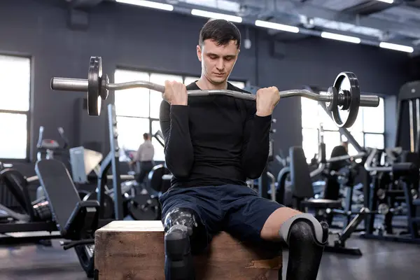 Ambitious Awesome Man Performs Barbell Exercises Sitting Wooden Box Lower — Stock Photo, Image
