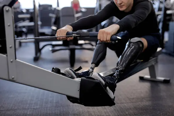 Disabled Person Uses Rowing Machine Sport Center Cropped Shot Focus — Stock Photo, Image