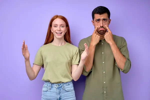 happy deaf redhead girl and unhappy sad deaf man, close up portrait isolated blue background.