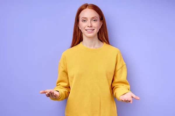 smiling friendly redhead business woman over isolated blue background standing with open arms welcome, positive and confident greetings. closeup portrait hello hi
