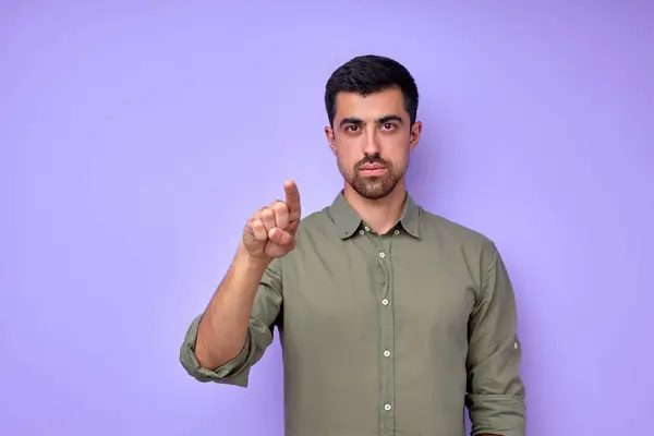 Hey, Its You. Portrait of young serious man in casual clothes pointing index finger at camera, guy picking, choosing and indicating, businessman showing to you