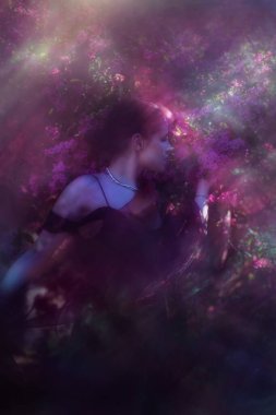 A young woman is appearing in a mystical lightful purple glow in double exposure at springtime. clipart