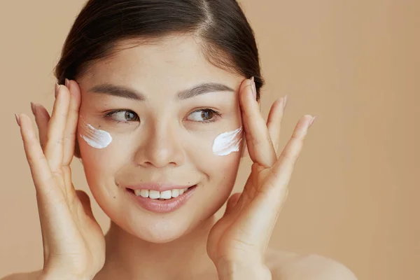 Portrait Modern Asian Female Facial Cream Face Beige Background — Stock Photo, Image