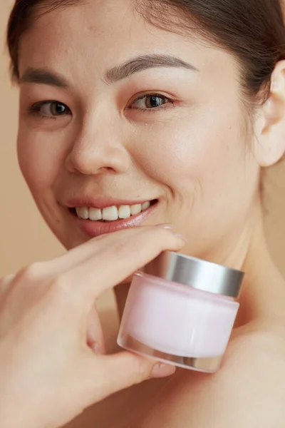 Portrait Modern Woman Facial Cream Jar Beige Background — Stock Photo, Image