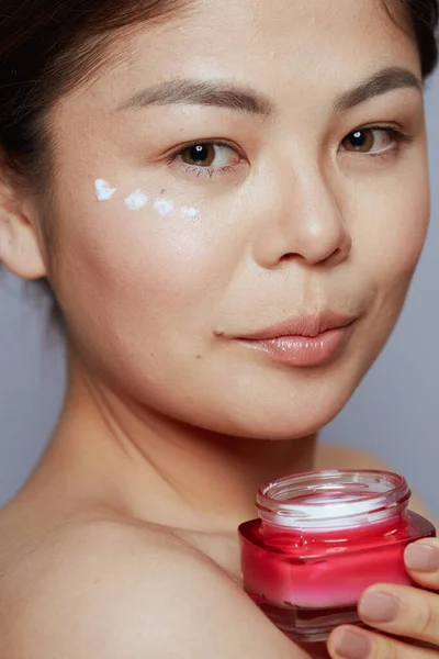 Young Woman Facial Cream Jar Eye Cream Face Blue Background — Stock Photo, Image
