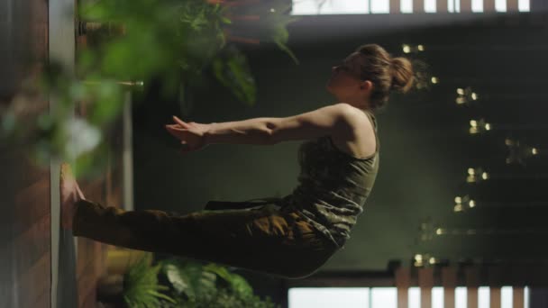 Modern Woman Modern Green House Doing Yoga — Stock Video