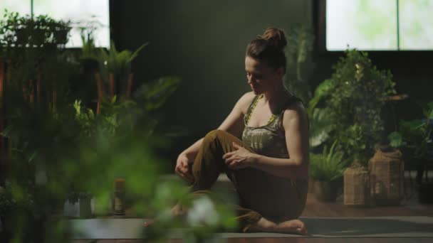 Modern Years Old Woman Yoga Mat Stretching Modern Green House — 图库视频影像