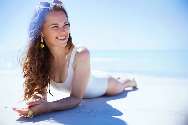 Smiling Stylish Middle Aged Woman White Swimwear Laying Beach — Stok fotoğraf