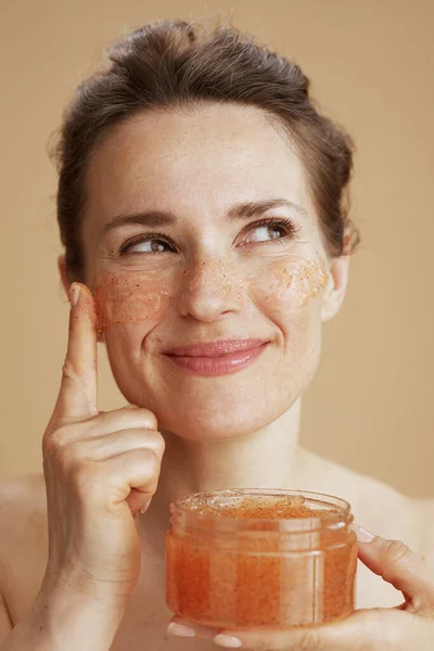 Happy Middle Aged Woman Face Scrub Beige Background — Stock Photo, Image
