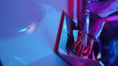 Neon metaverse futuristic concept. Closeup on woman with laptop in office.