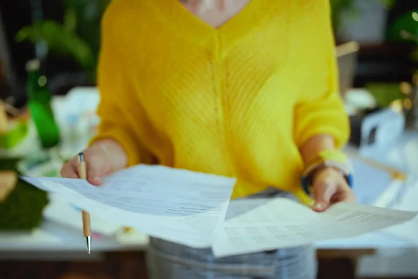 Closeup Small Business Owner Woman Yellow Sweater Working Documents Green — Foto Stock