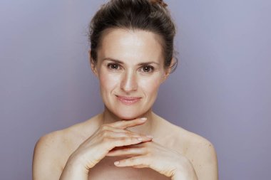 happy young female isolated on blue background.