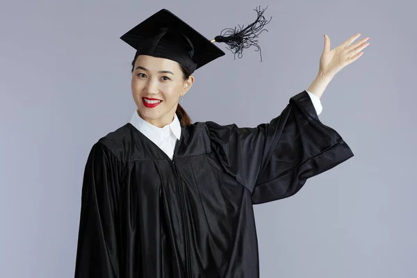 Cheerful Modern Graduate Student Asian Woman Graduation Gown Cap Throwing — Stockfoto