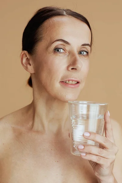 Modern Woman Glass Water Beige Background — Zdjęcie stockowe
