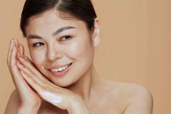 Portrait Modern Asian Woman Hand Cream Beige Background — Foto de Stock