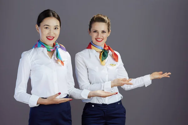 Smiling Elegant Female Stewardesses Blue Skirt White Shirt Scarf Welcoming — Stock Photo, Image