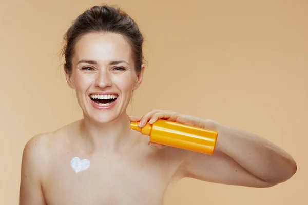 Smiling Modern Woman Cosmetic Cream Jar Heart Shaped Cream Chest — Stock Photo, Image