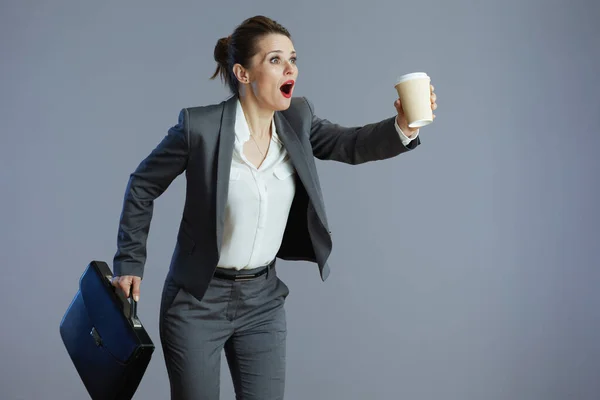 Shocked Stylish Female Worker Grey Suit Coffee Cup Briefcase Running — Stock Photo, Image