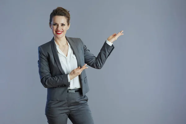 Happy Modern Middle Aged Business Woman Grey Suit Welcoming Isolated — Stock Photo, Image