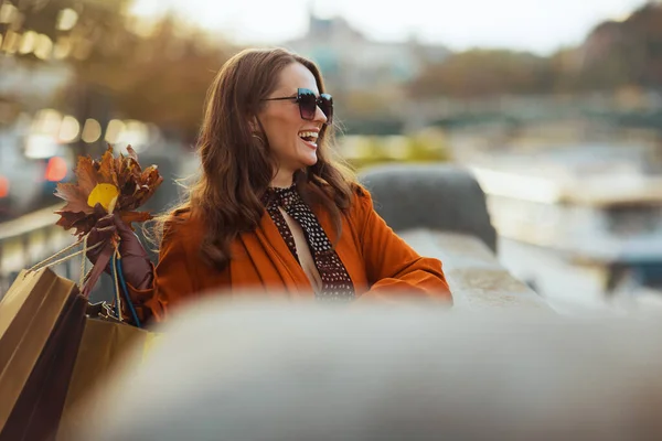 Hello October Smiling Trendy Female Orange Trench Coat Shopping Bags — Stock Photo, Image