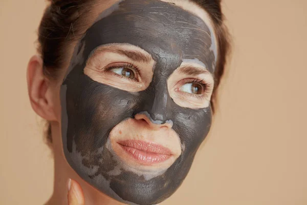 Pensive Modern Female Cosmetic Mask Isolated Beige Background — Stock Photo, Image