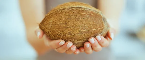 Closeup Woman Showing Coconut — Stock Photo, Image
