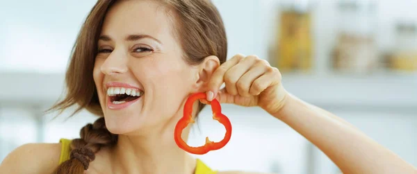 Happy Young Woman Using Slice Bell Pepper Earring — Stock Photo, Image
