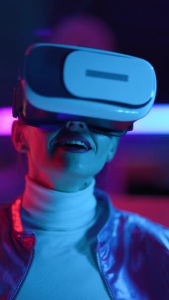 Neon Metaverse Futuristic Concept Surprised Modern Woman Virtual Reality Goggles — Stockvideo