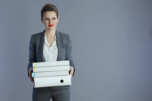 Pensive Trendy Middle Aged Business Woman Gray Suit Folders Isolated — Stock Photo, Image