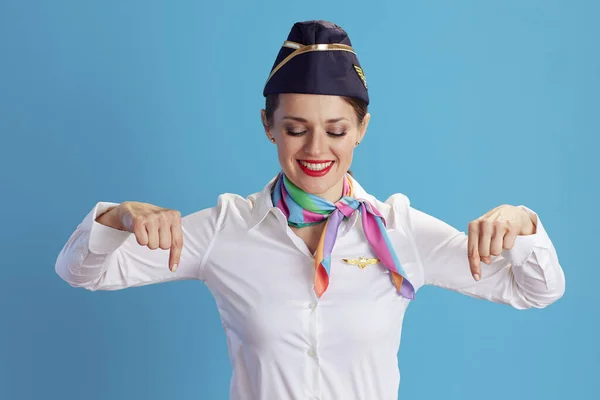 Smiling Elegant Air Hostess Woman Blue Background Uniform Pointing Copy — Stock Photo, Image